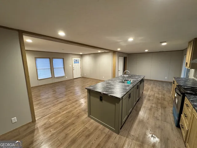 a kitchen with a sink and washer