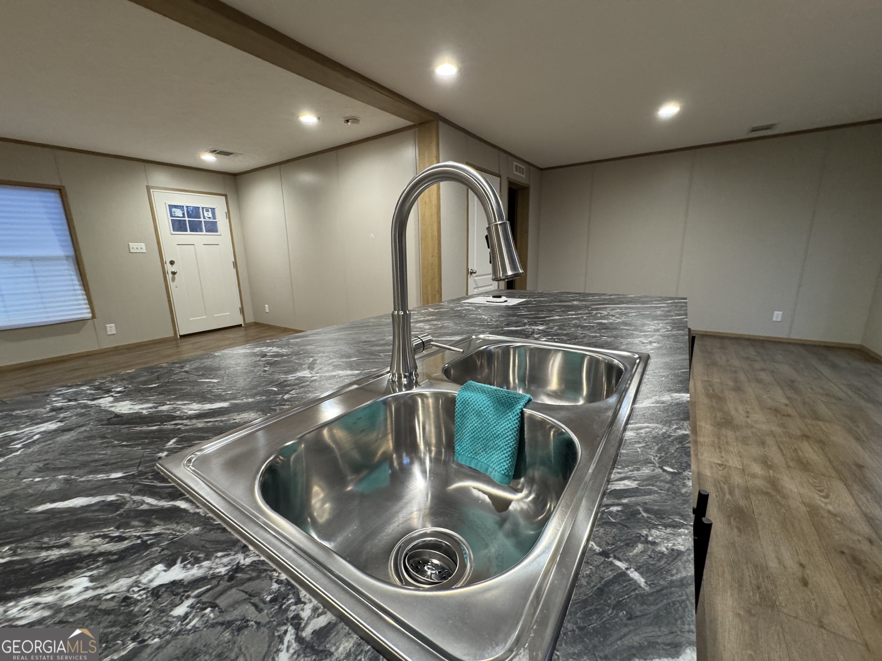 215 Poplar Circle West Point, GA 31833 - Photo 6 of 15 a kitchen with a sink and washer