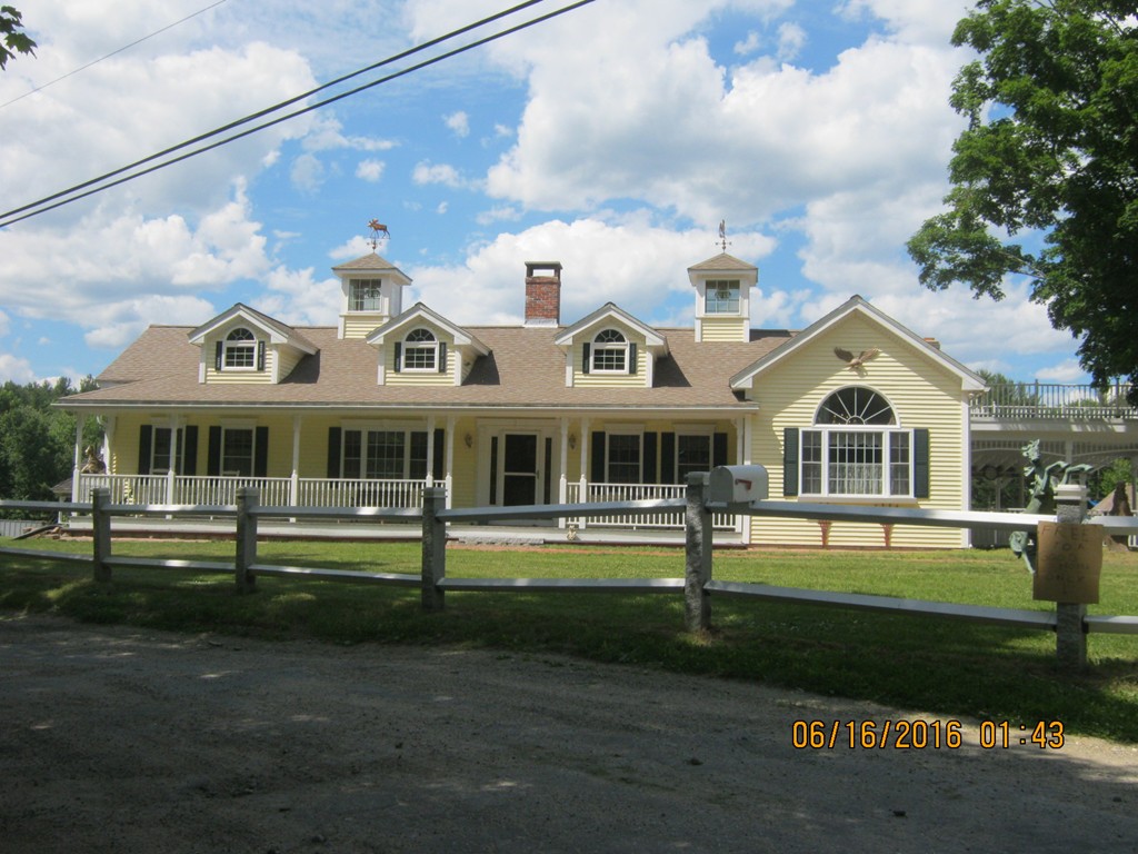 220 Davis Road Ashby, MA 01431 - Photo 1 of 30 a front view of a house with a yard