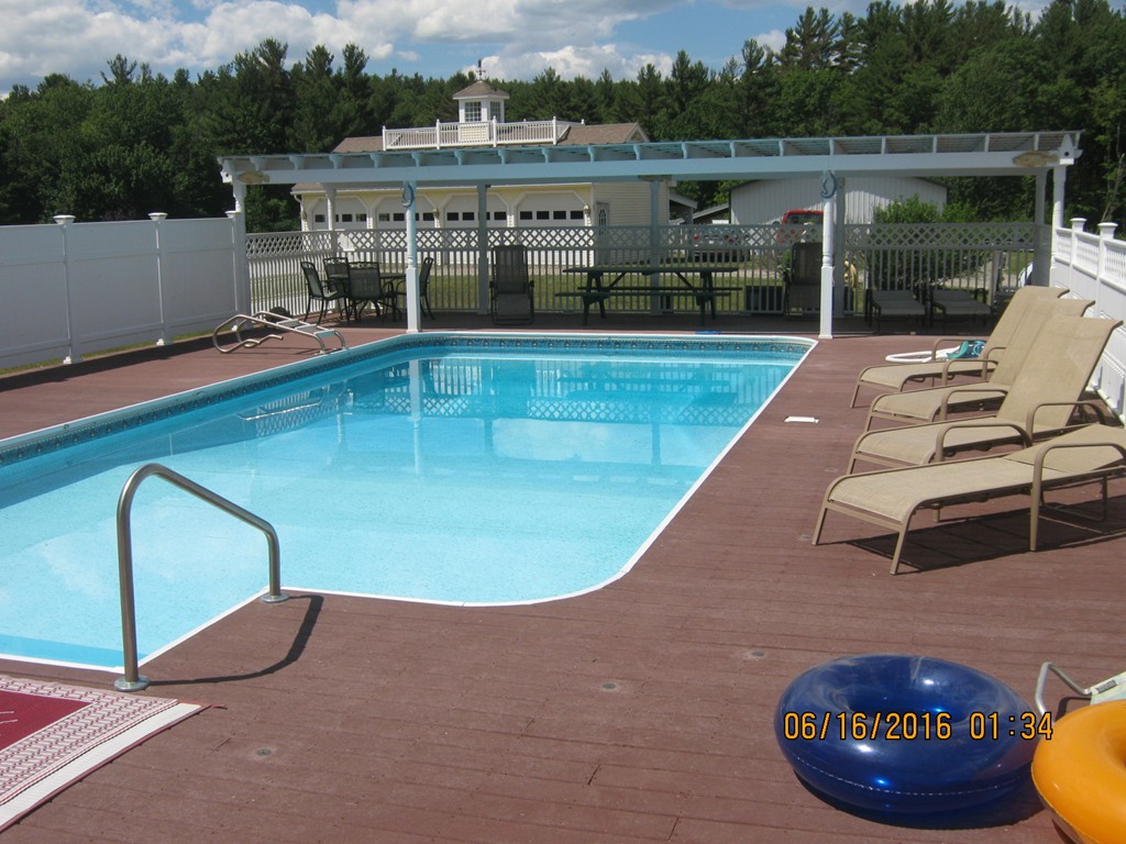 220 Davis Road Ashby, MA 01431 - Photo 20 of 30 a view of a swimming pool with lounge chair