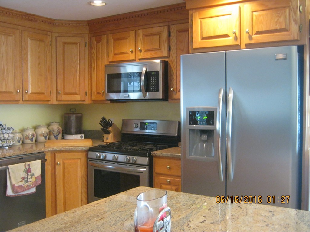 220 Davis Road Ashby, MA 01431 - Photo 3 of 30 a kitchen with stainless steel appliances granite countertop a stove a sink and a refrigerator