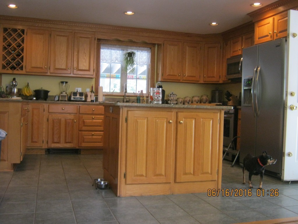 220 Davis Road Ashby, MA 01431 - Photo 5 of 30 a kitchen with stainless steel appliances granite countertop a refrigerator and a stove top oven