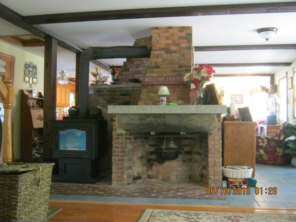220 Davis Road Ashby, MA 01431 - Photo 8 of 30 a fireplace with wooden floor