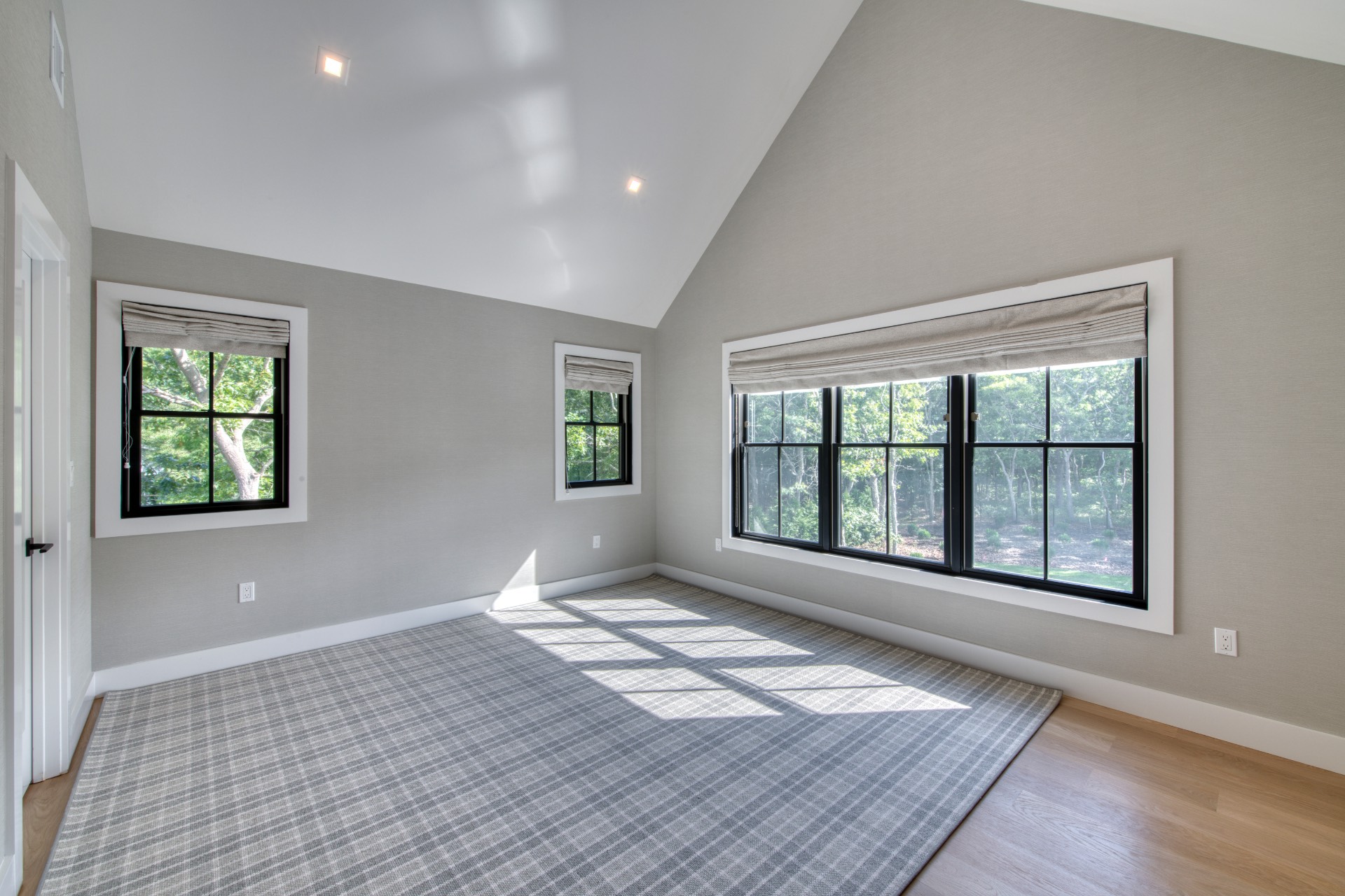 497 Toppings Path Sag Harbor, NY 11963 - Photo 9 of 12 a view of an empty room with a window and wooden floor