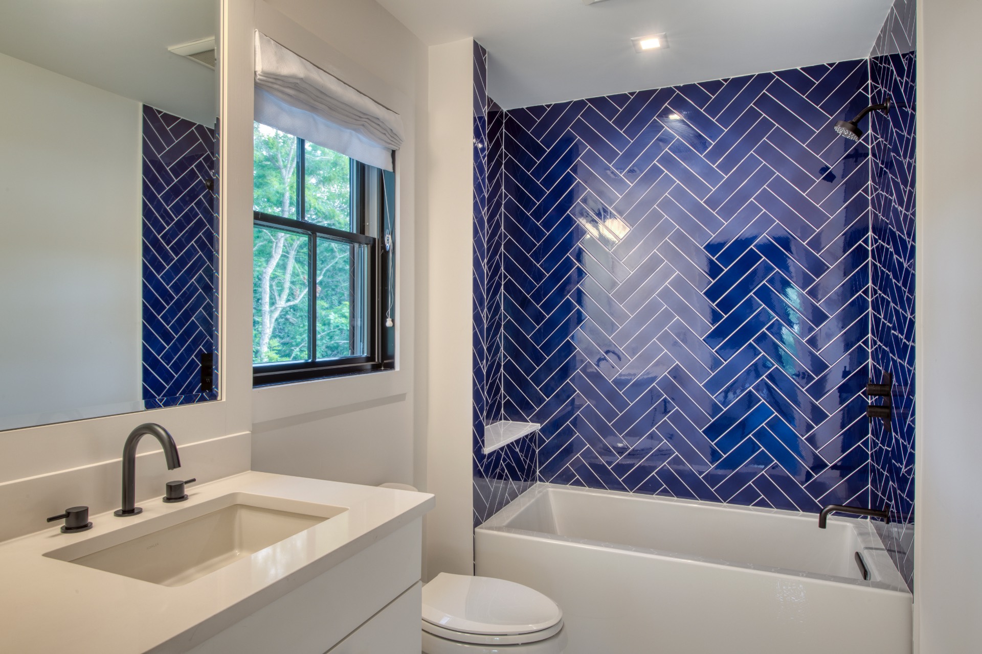 497 Toppings Path Sag Harbor, NY 11963 - Photo 10 of 12 a bathroom with a sink and a bathtub