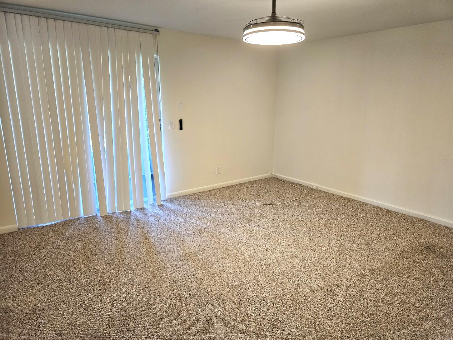 1059 Ainslie Drive, Unit 1059 Boca Raton, FL 33434 - Photo 12 of 15 an empty room with a window