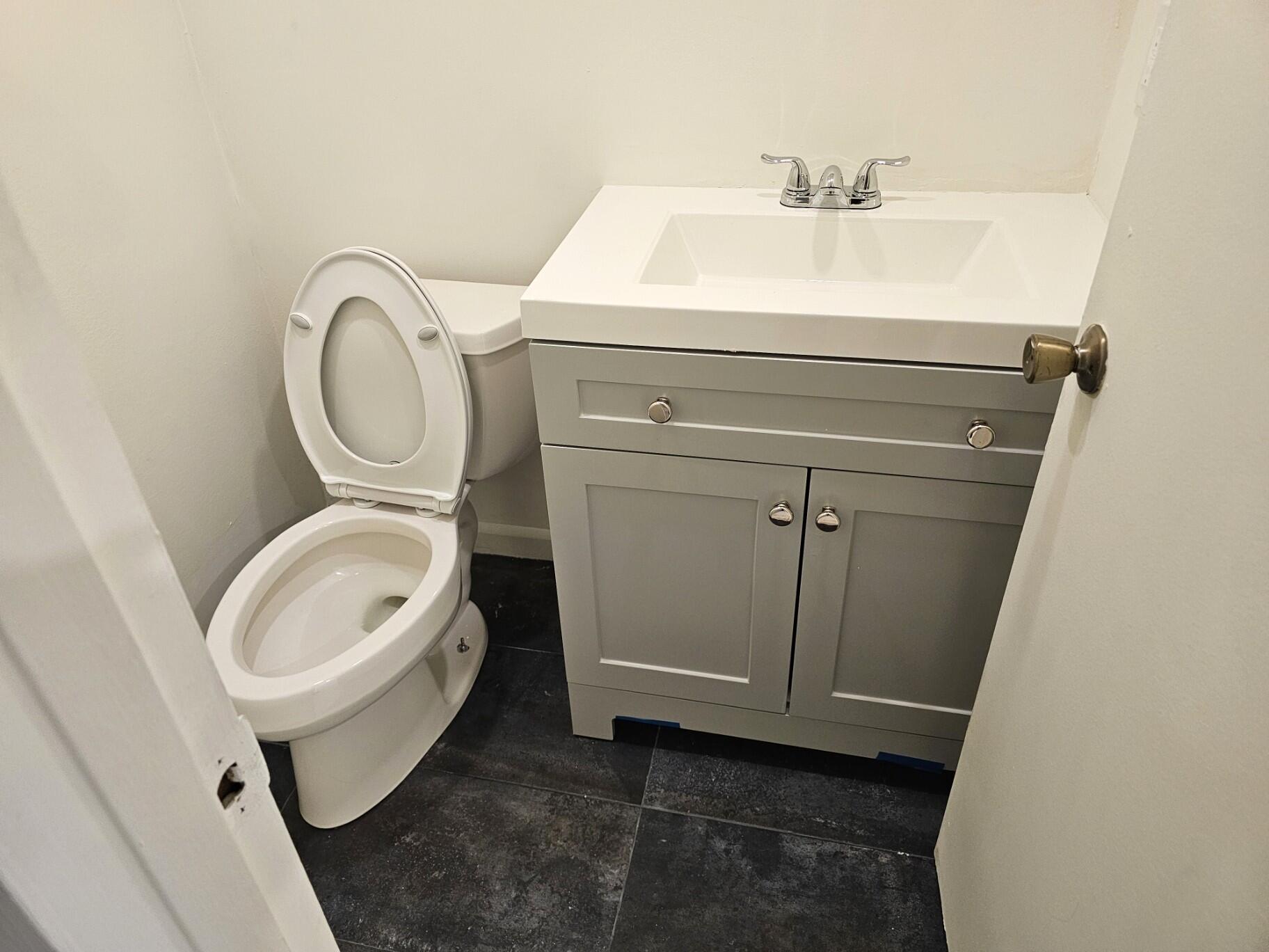 1059 Ainslie Drive, Unit 1059 Boca Raton, FL 33434 - Photo 15 of 15 a bathroom with a toilet and a sink