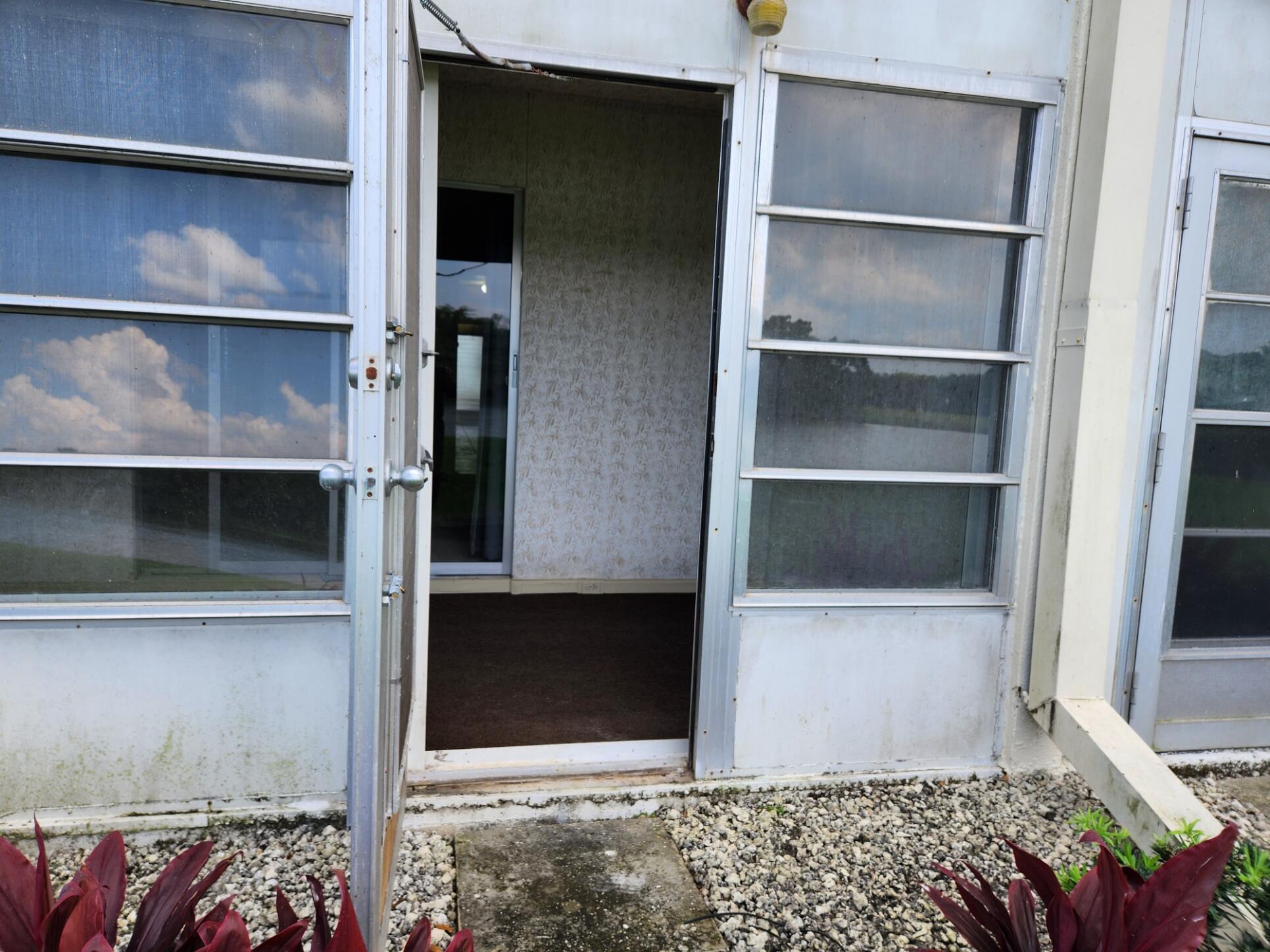 1059 Ainslie Drive, Unit 1059 Boca Raton, FL 33434 - Photo 5 of 15 a room with storage and utility