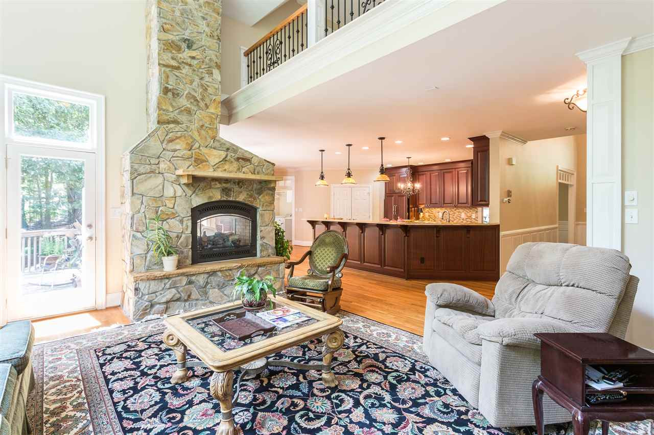 1001 Clingmans Place Raleigh, NC 27614 - Photo 8 of 30 The family room is open to the kitchen and offers a new see-through gas fireplace with stone surround, mantel and hearth. Family Room Open to Kitchen