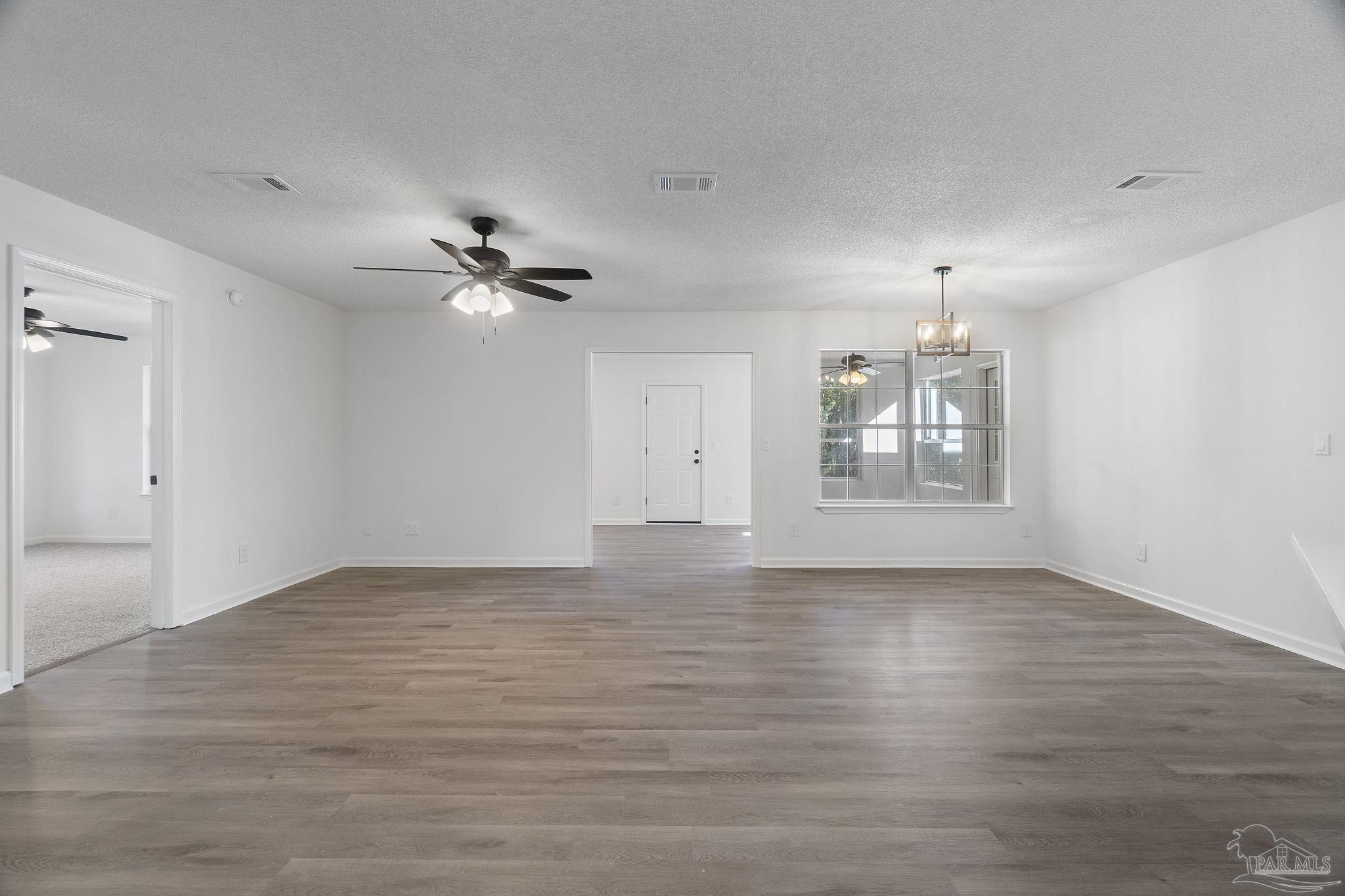 195 Miller Road DeFuniak Springs, FL 32435 - Photo 19 of 50 an empty room with fan and windows