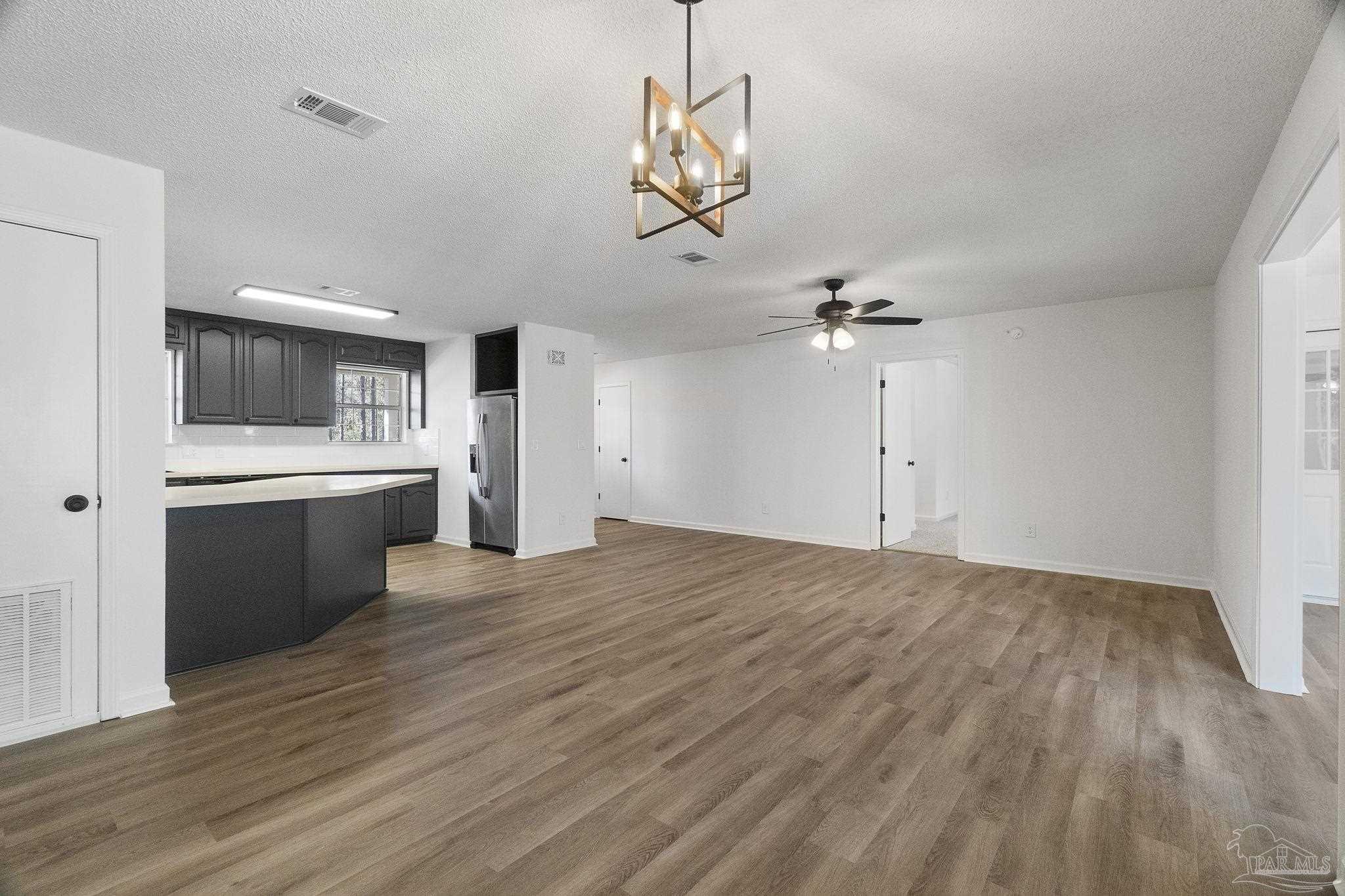 195 Miller Road DeFuniak Springs, FL 32435 - Photo 20 of 50 a view of a kitchen with a sink dishwasher a kitchen view and a refrigerator
