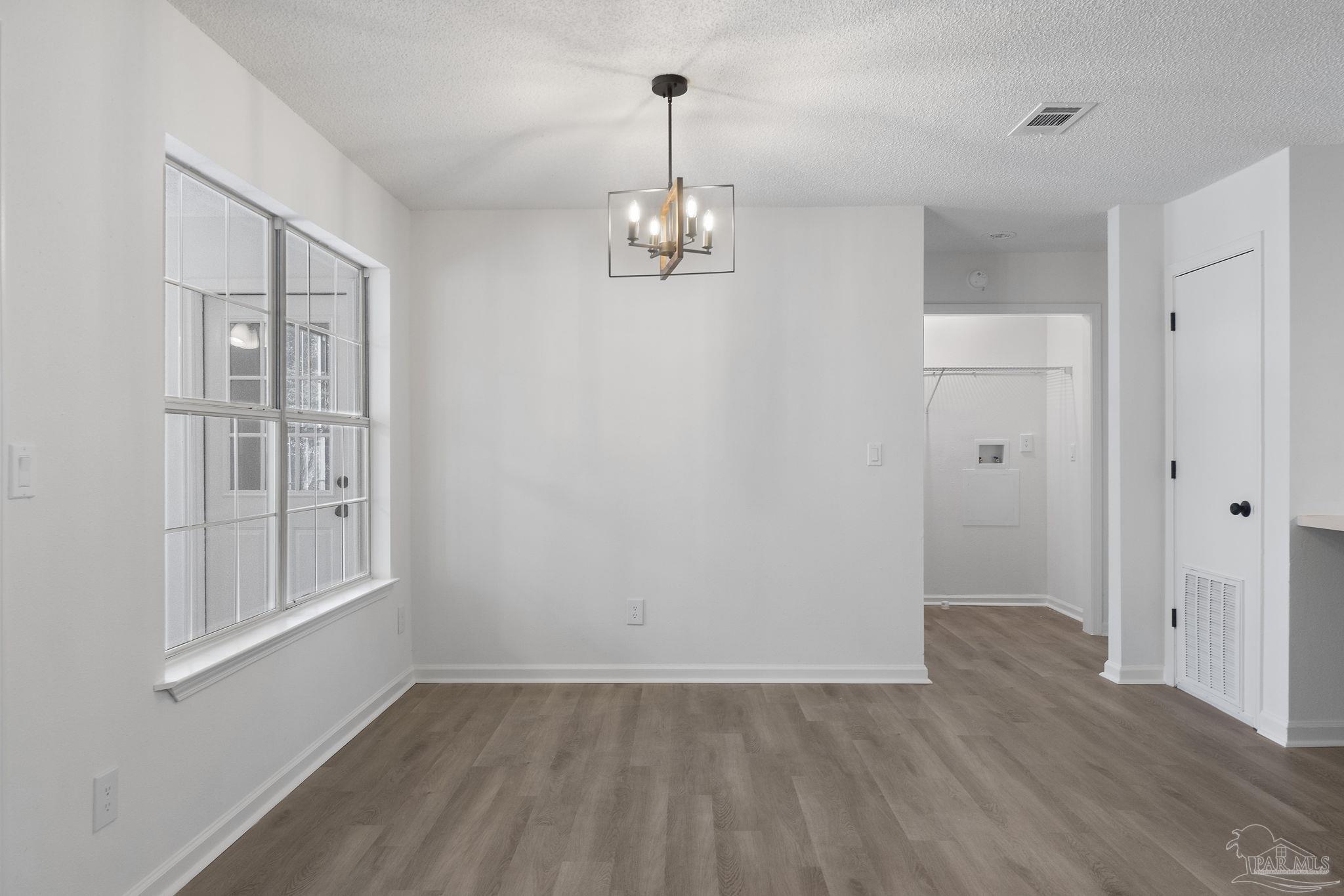 195 Miller Road DeFuniak Springs, FL 32435 - Photo 21 of 50 a view of empty room with wooden floor