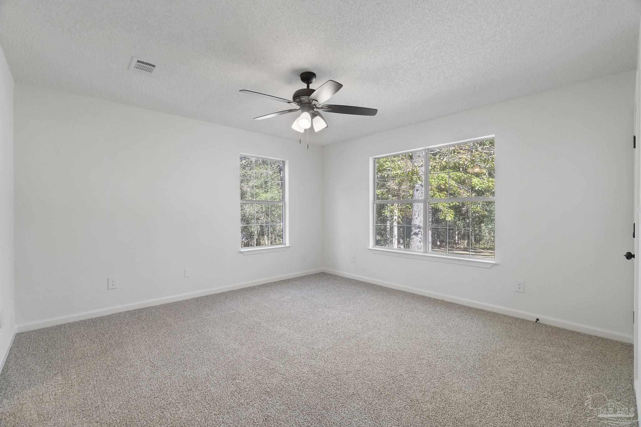 195 Miller Road DeFuniak Springs, FL 32435 - Photo 26 of 50 a view of room with a ceiling fan and a window
