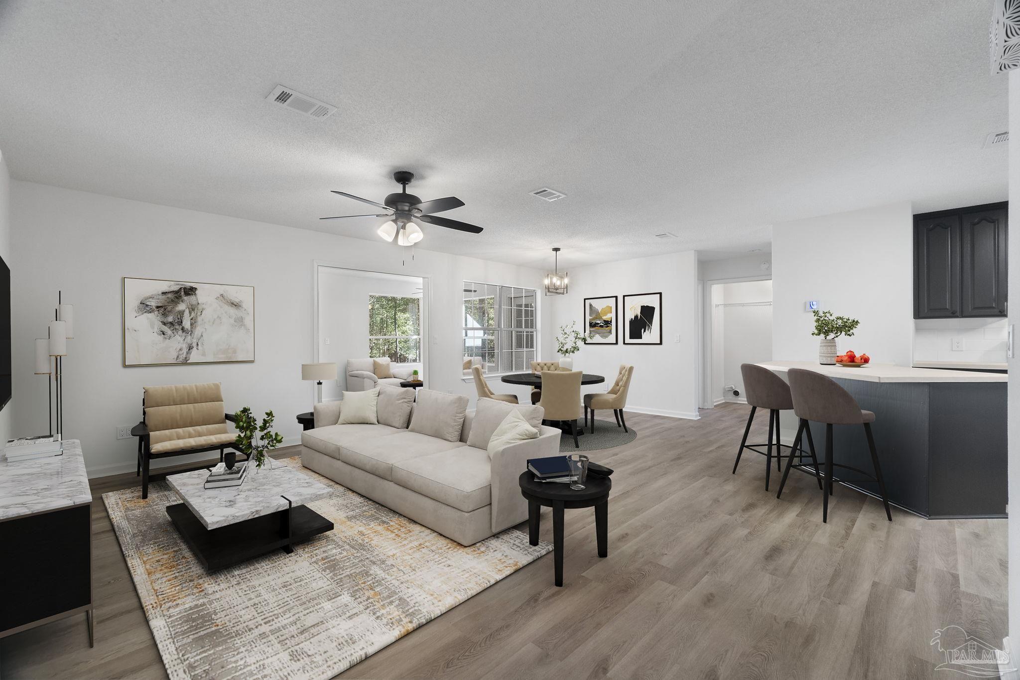 195 Miller Road DeFuniak Springs, FL 32435 - Photo 3 of 50 a living room with furniture and a wooden floor
