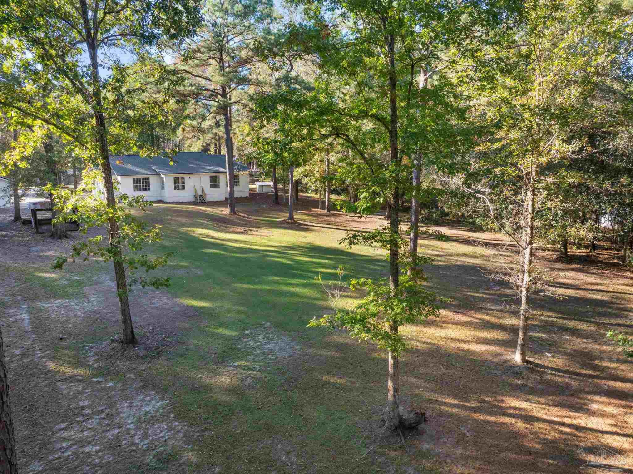 195 Miller Road DeFuniak Springs, FL 32435 - Photo 35 of 50 a view of a house with backyard