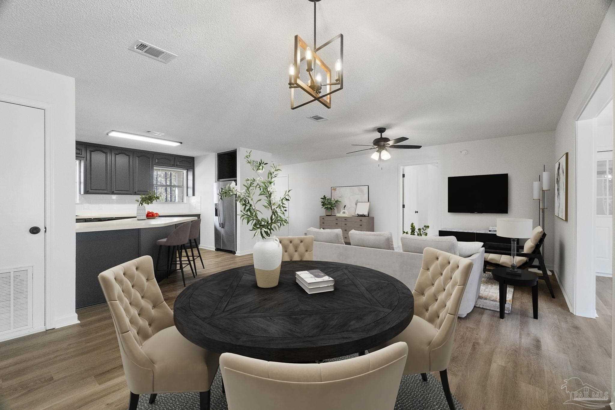 195 Miller Road DeFuniak Springs, FL 32435 - Photo 4 of 50 a dining room with furniture a chandelier and wooden floor