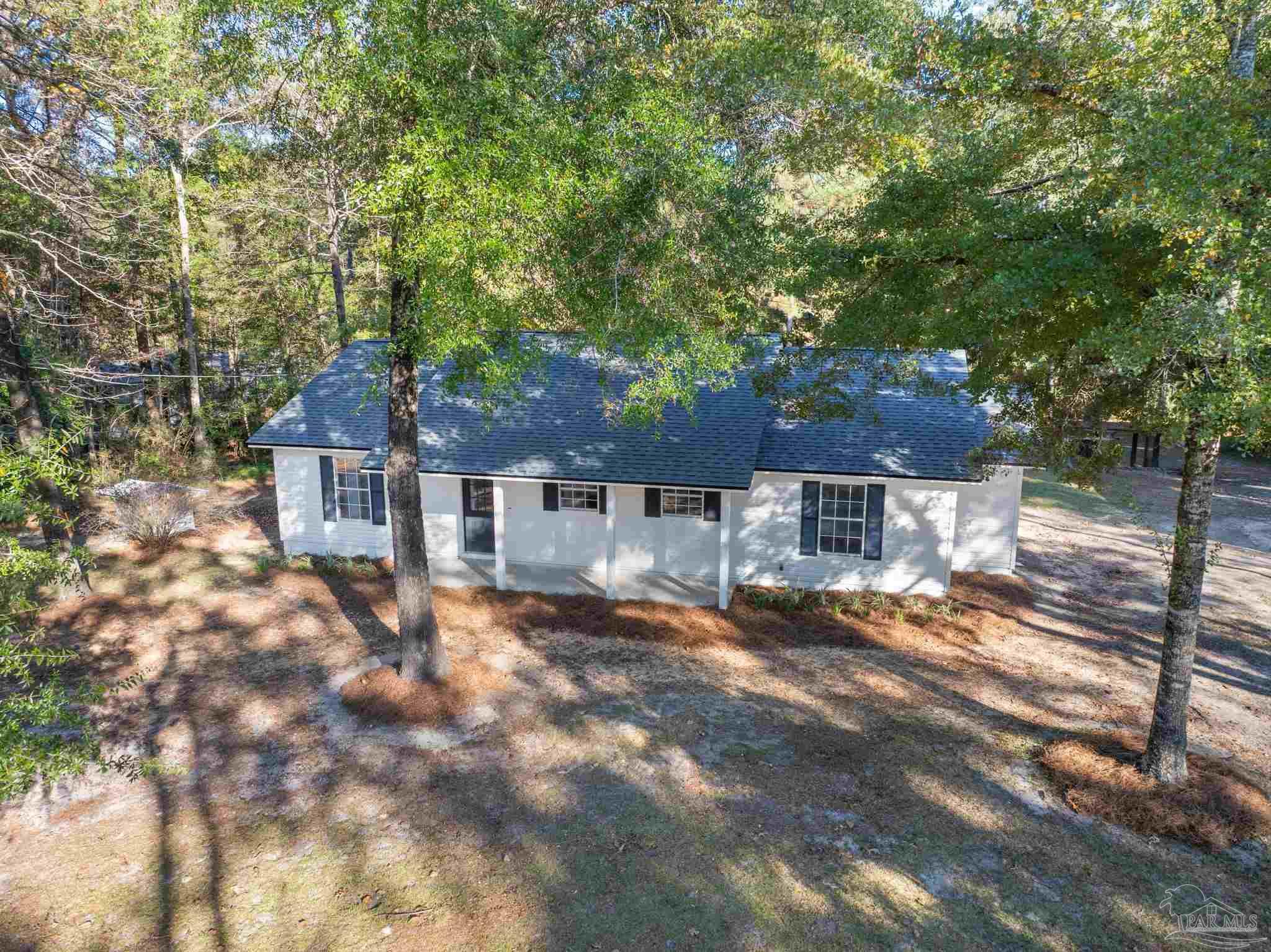 195 Miller Road DeFuniak Springs, FL 32435 - Photo 41 of 50 a view of a house with a yard