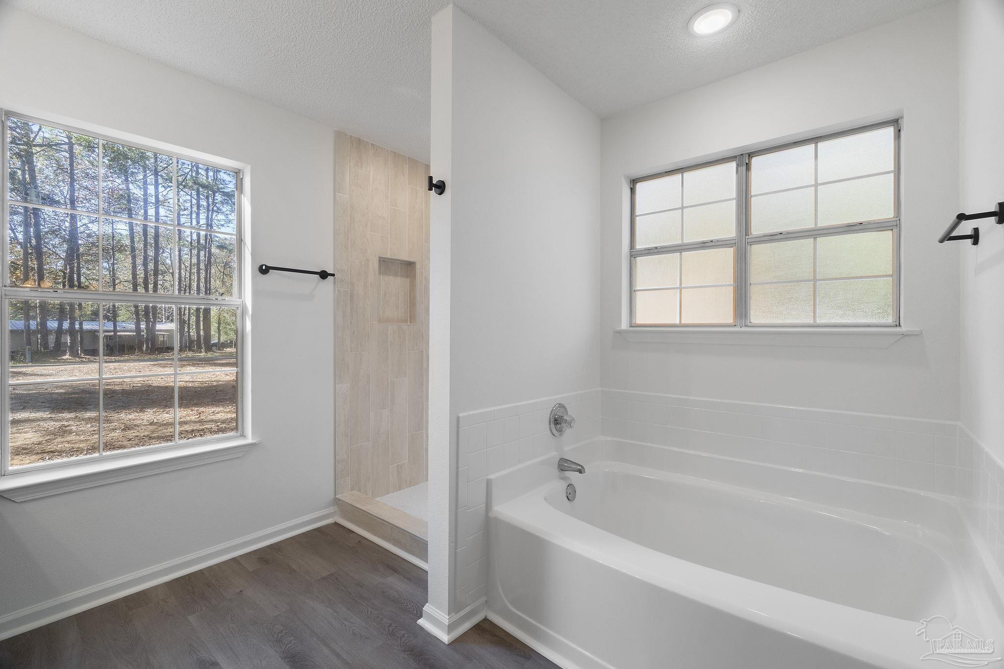 195 Miller Road DeFuniak Springs, FL 32435 - Photo 8 of 50 a white bath tub sitting next to a window