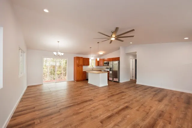a view of a kitchen with a sink and a window