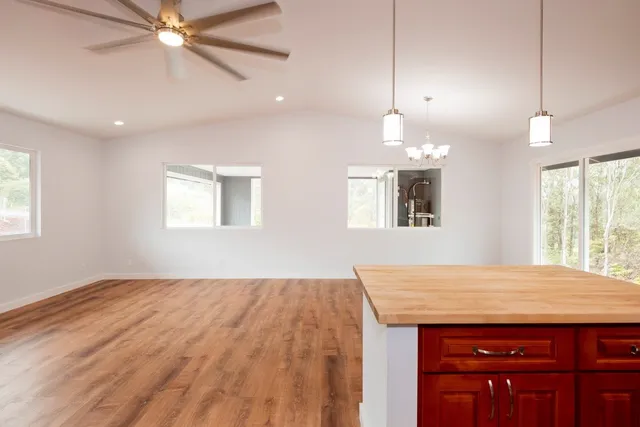 a view of a kitchen with a sink and a window