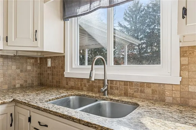 a close view of a sink and a window