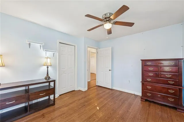 a view of room with wooden floor and window