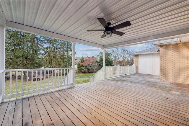 a view of a balcony with wooden floor