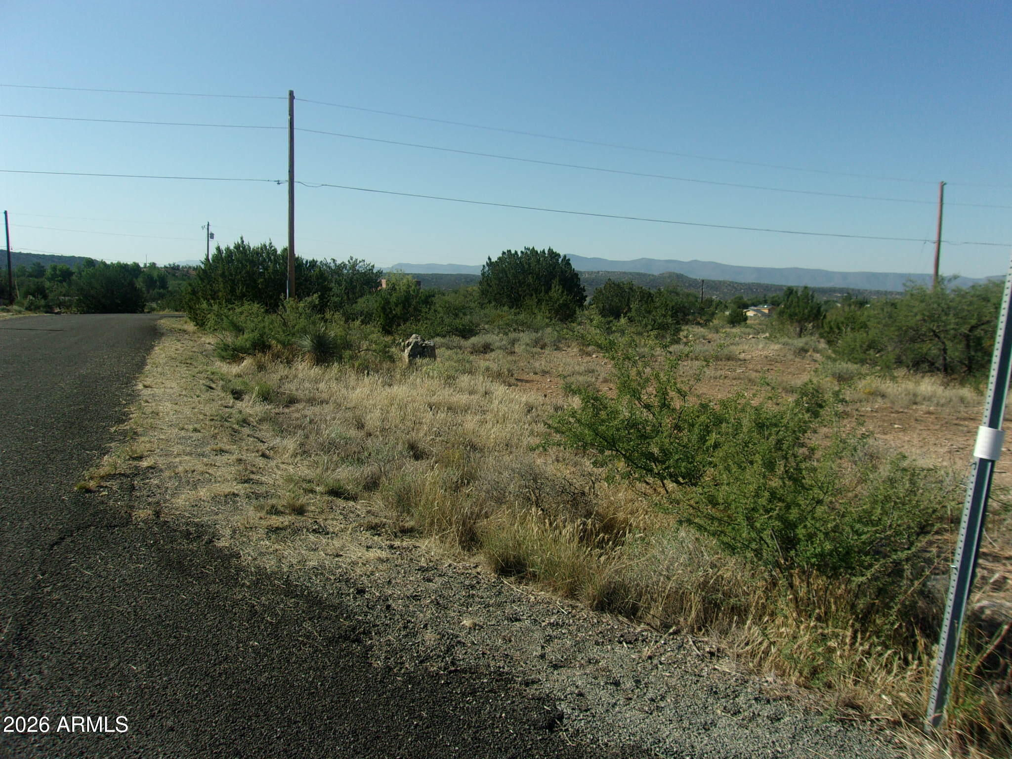 4875 Smoke Signal Way, Unit 103 Rimrock, AZ 86335 - Photo 2 of 15 a view of a field with an tree