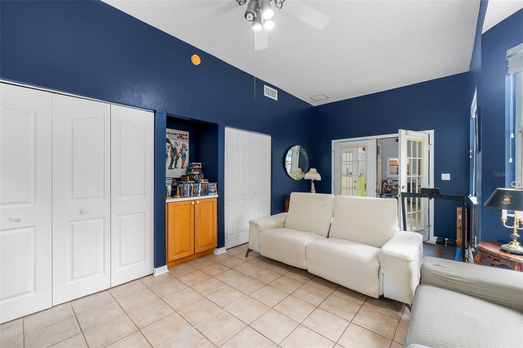 3448 Northwest 68 Road Gainesville, FL 32653 - Photo 19 of 51 a living room with furniture and a chandelier
