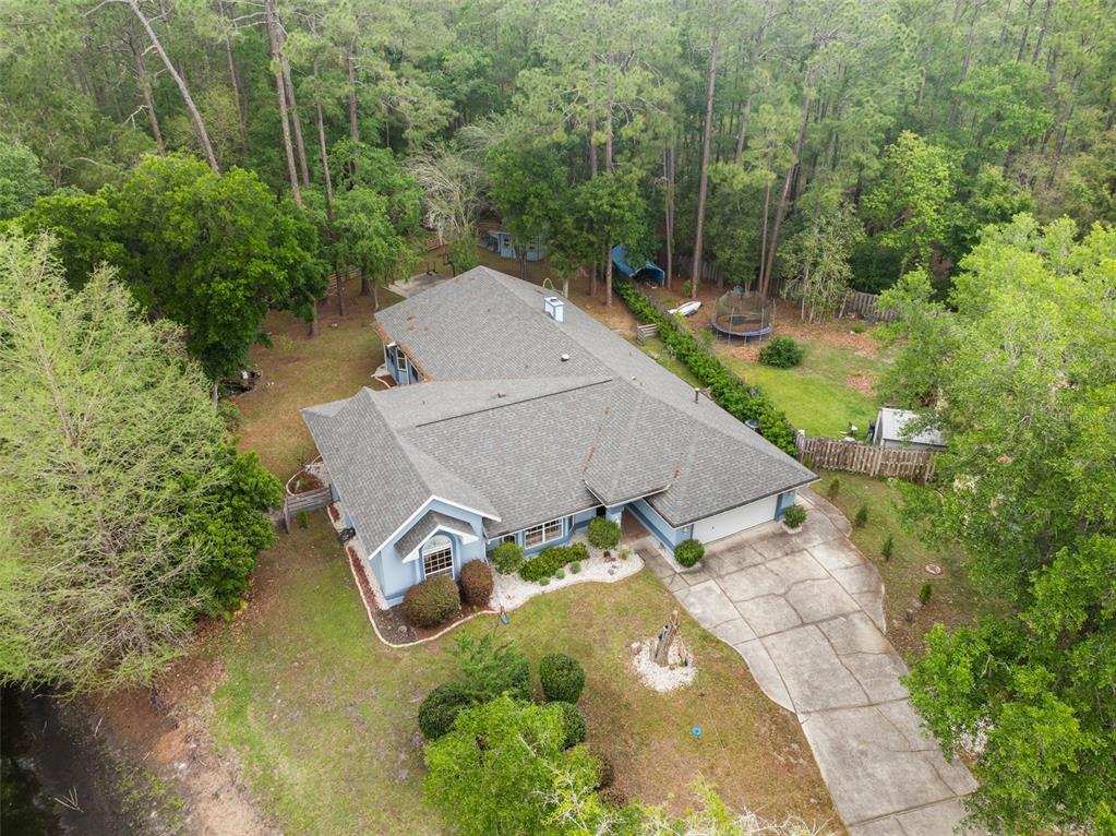 3448 Northwest 68 Road Gainesville, FL 32653 - Photo 2 of 51 an aerial view of a house with a yard