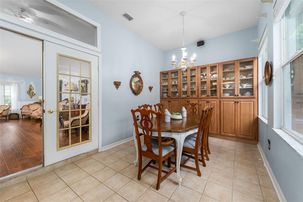 3448 Northwest 68 Road Gainesville, FL 32653 - Photo 22 of 51 a view of a dining room with furniture and chandelier