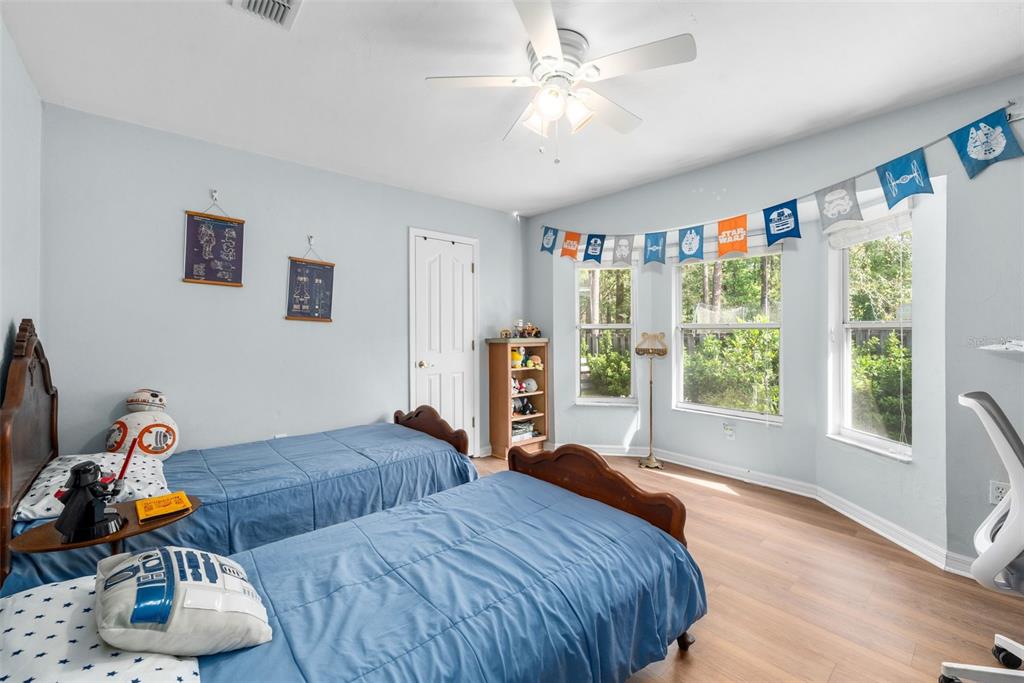 3448 Northwest 68 Road Gainesville, FL 32653 - Photo 29 of 51 a bedroom with furniture and a window