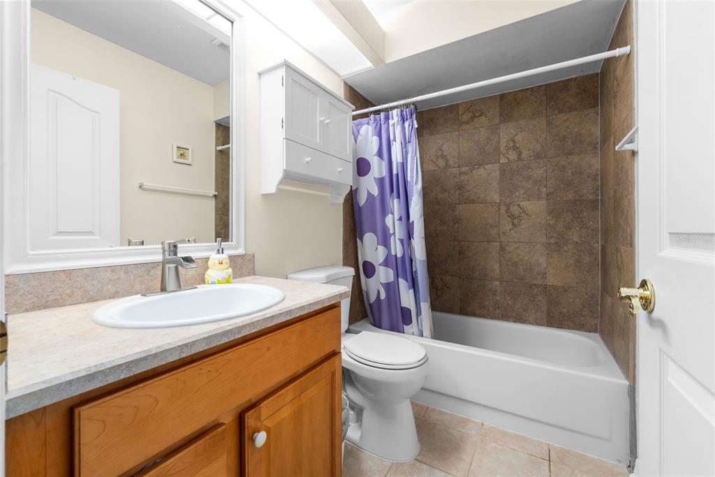 3448 Northwest 68 Road Gainesville, FL 32653 - Photo 31 of 51 a bathroom with a sink a toilet and a bathtub