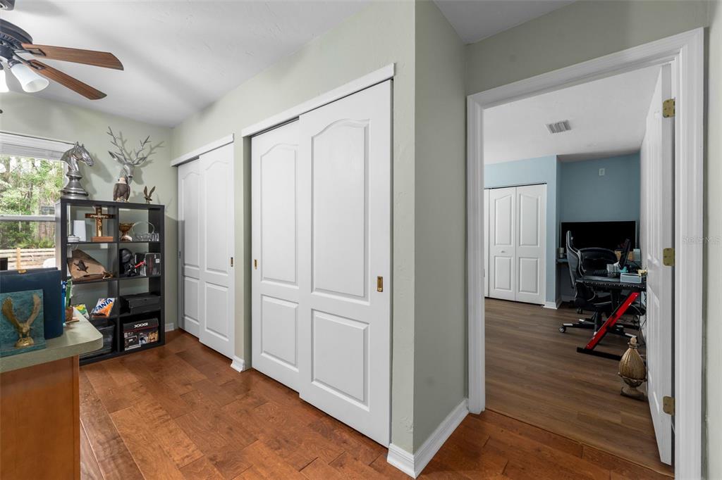 3448 Northwest 68 Road Gainesville, FL 32653 - Photo 33 of 51 a view of walk in closet with clothes and shoes