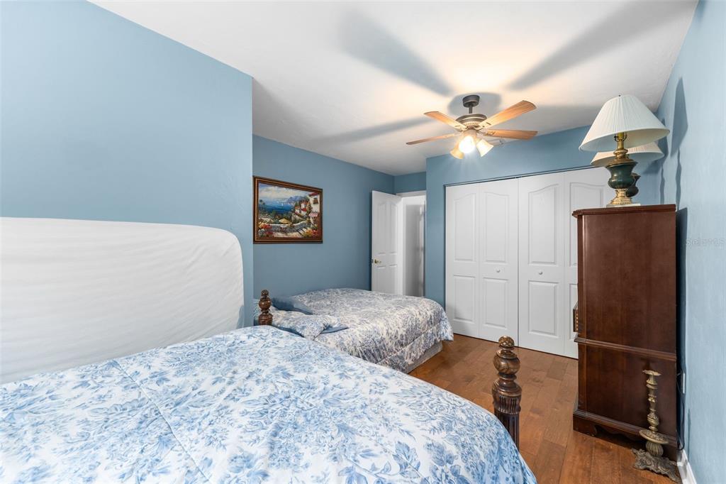 3448 Northwest 68 Road Gainesville, FL 32653 - Photo 35 of 51 a bedroom with a bed and a chandelier