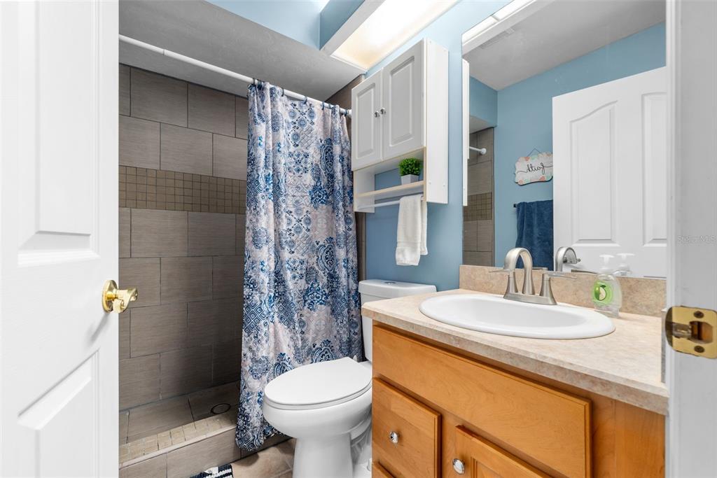 3448 Northwest 68 Road Gainesville, FL 32653 - Photo 36 of 51 a bathroom with a sink toilet and shower