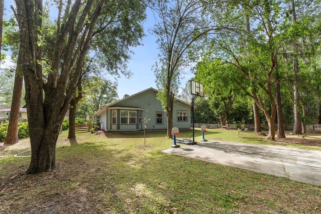 3448 Northwest 68 Road Gainesville, FL 32653 - Photo 43 of 51 a view of a house with a backyard