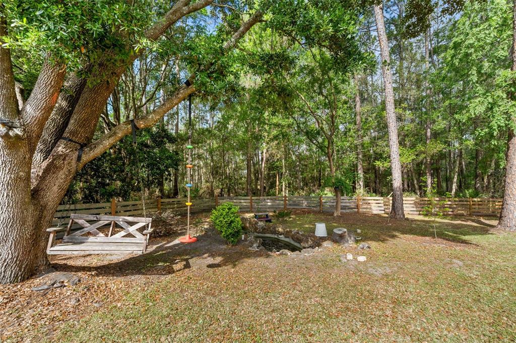 3448 Northwest 68 Road Gainesville, FL 32653 - Photo 46 of 51 a view of a park with large trees