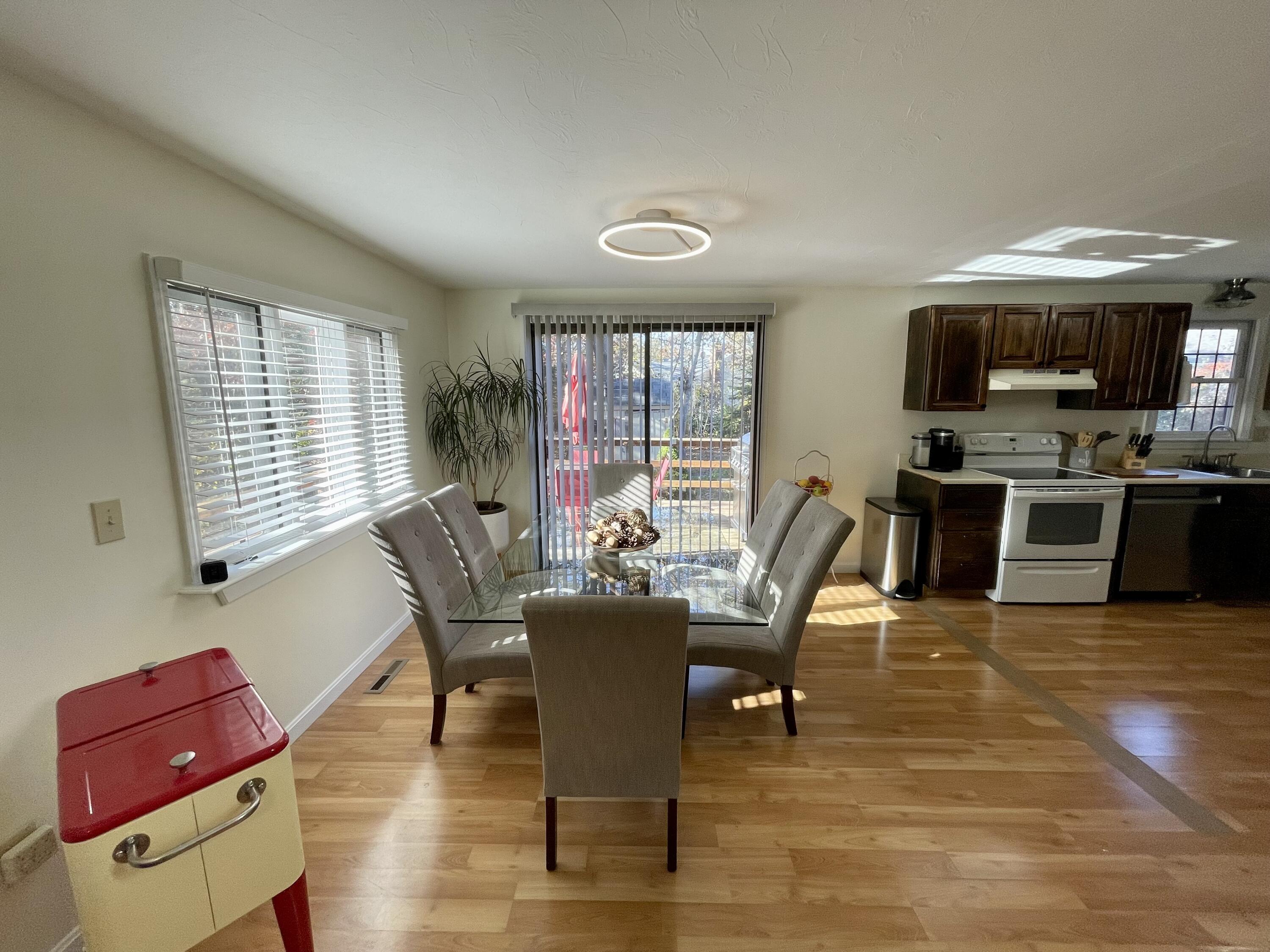 97 Braley Jenkins Road Centerville, MA 02632 - Photo 14 of 39 a view of a dining room with furniture window and wooden floor