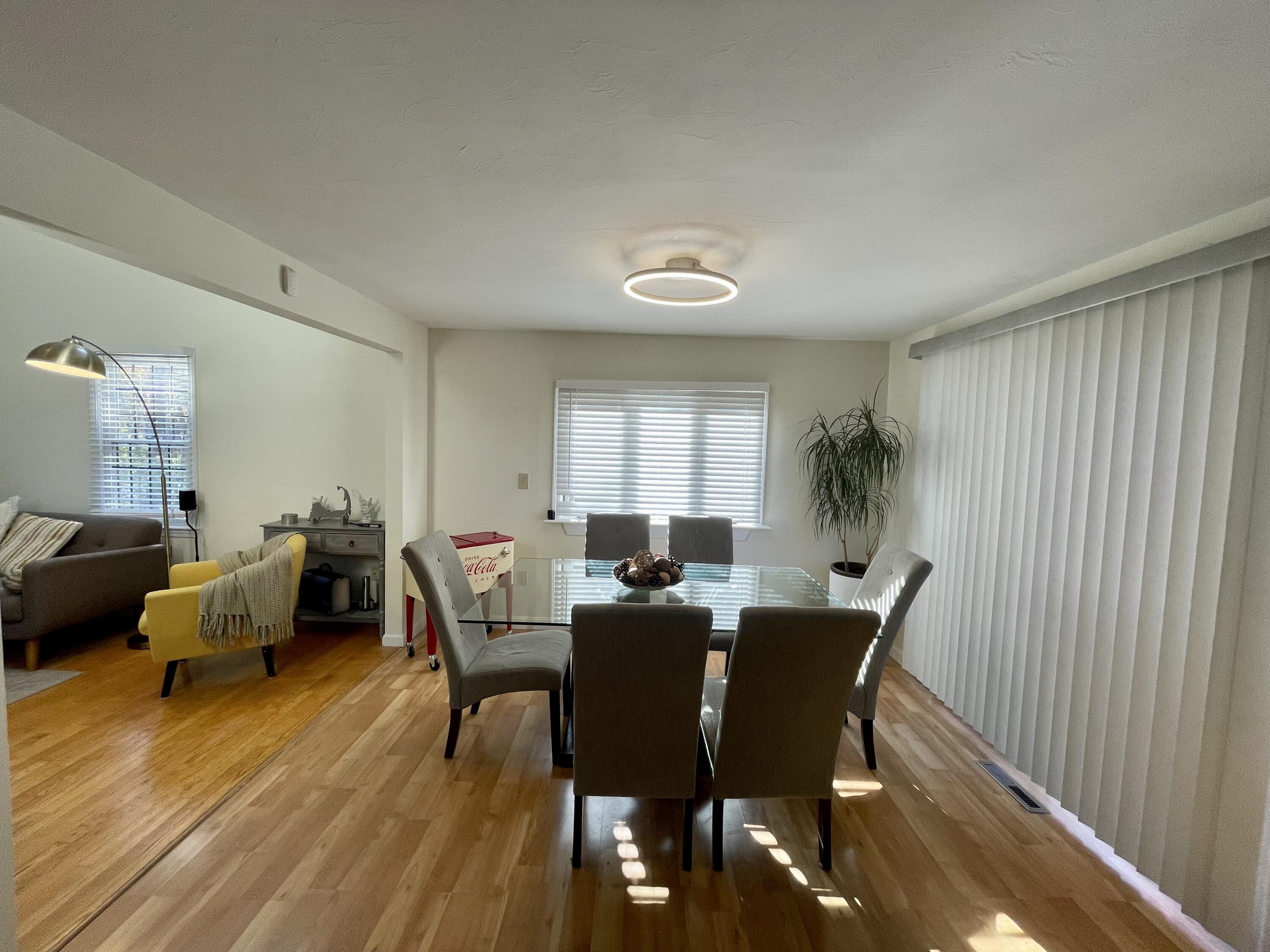 97 Braley Jenkins Road Centerville, MA 02632 - Photo 16 of 39 a view of a dining room with furniture window and wooden floor