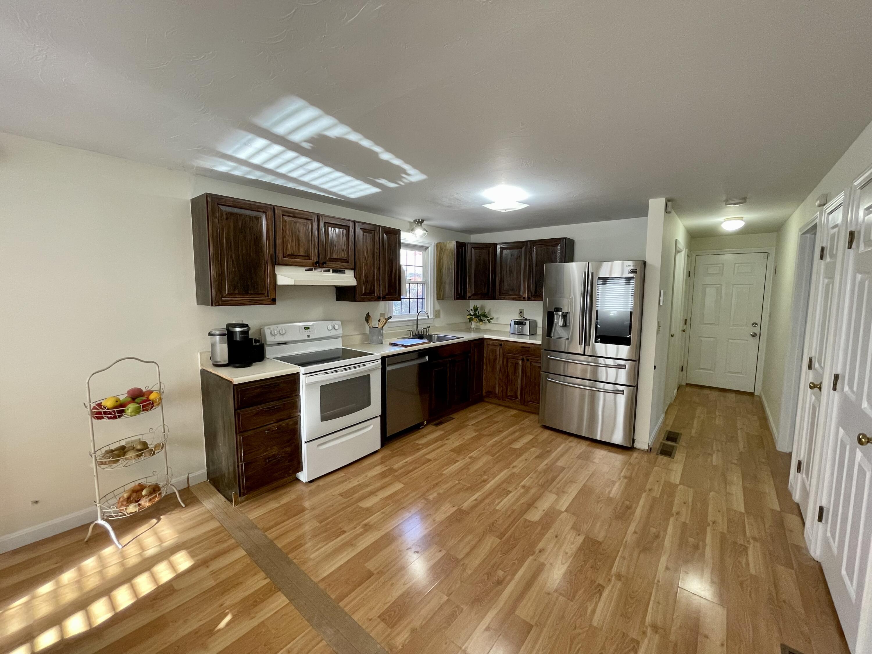 97 Braley Jenkins Road Centerville, MA 02632 - Photo 20 of 39 a large kitchen with cabinets and stainless steel appliances