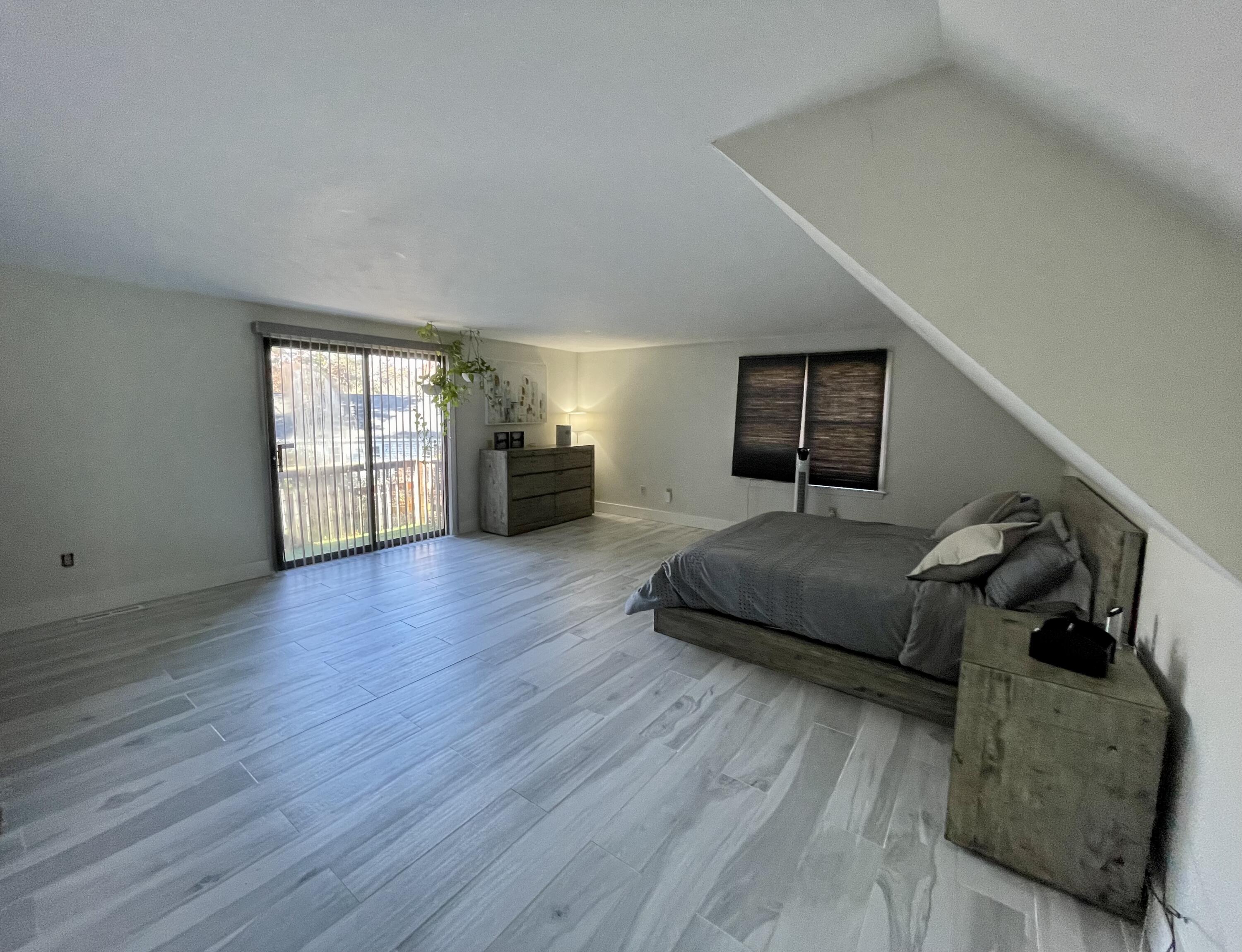 97 Braley Jenkins Road Centerville, MA 02632 - Photo 23 of 39 a bedroom with a bed and wooden floor