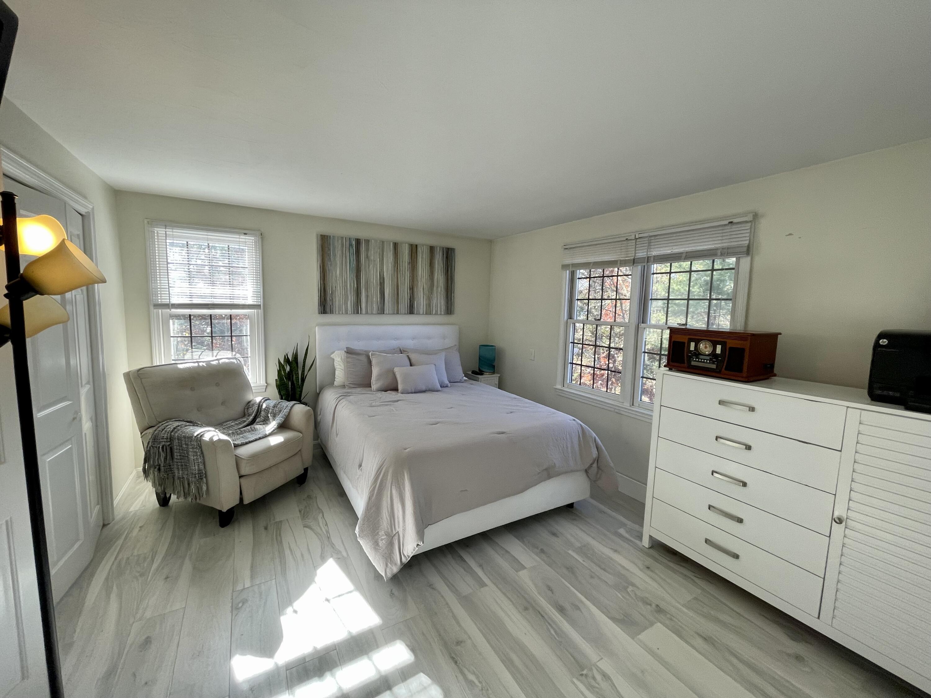 97 Braley Jenkins Road Centerville, MA 02632 - Photo 28 of 39 a bedroom with a bed and a dresser
