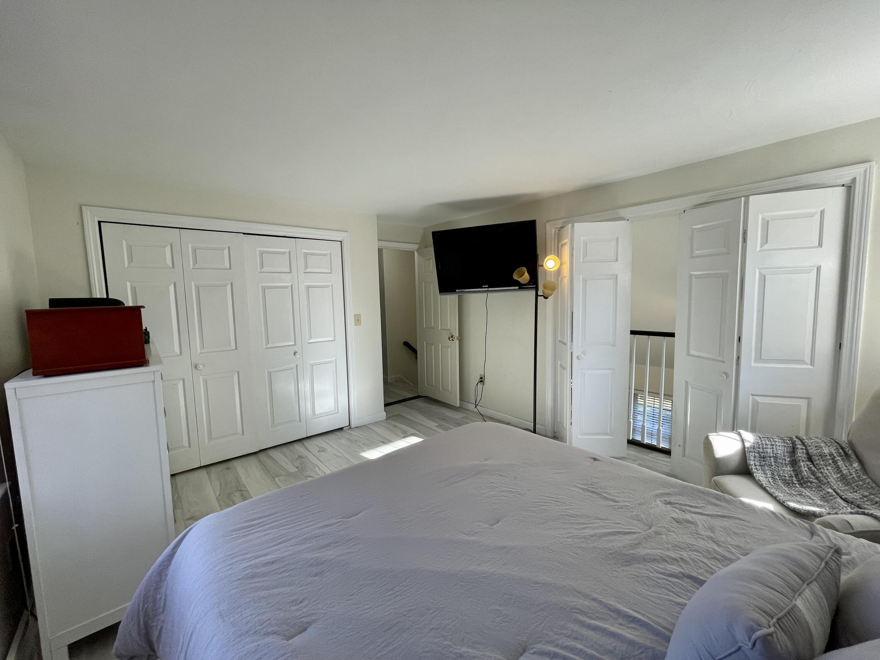 97 Braley Jenkins Road Centerville, MA 02632 - Photo 30 of 39 a bedroom with a bed and a television