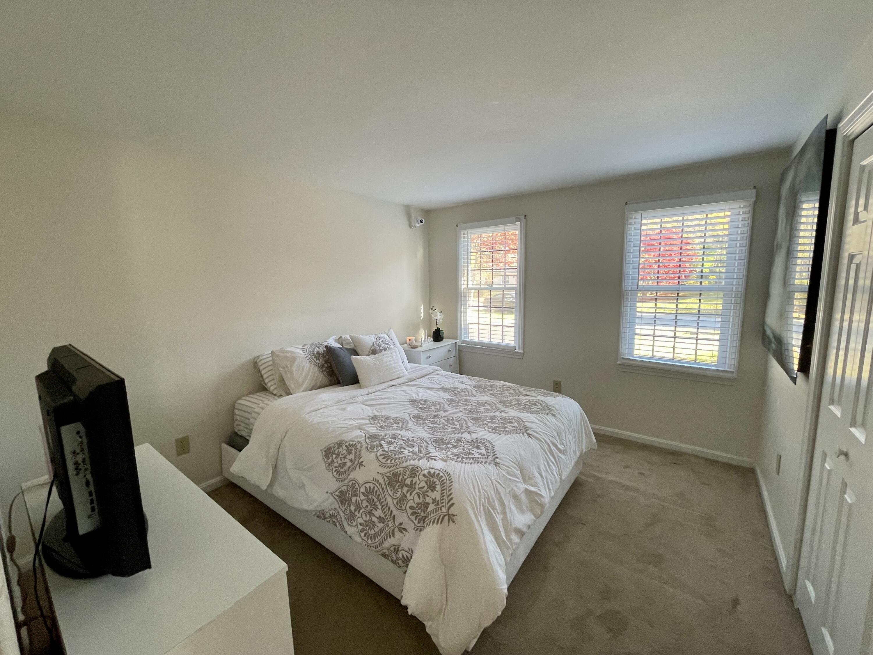 97 Braley Jenkins Road Centerville, MA 02632 - Photo 32 of 39 a bedroom with bed and window