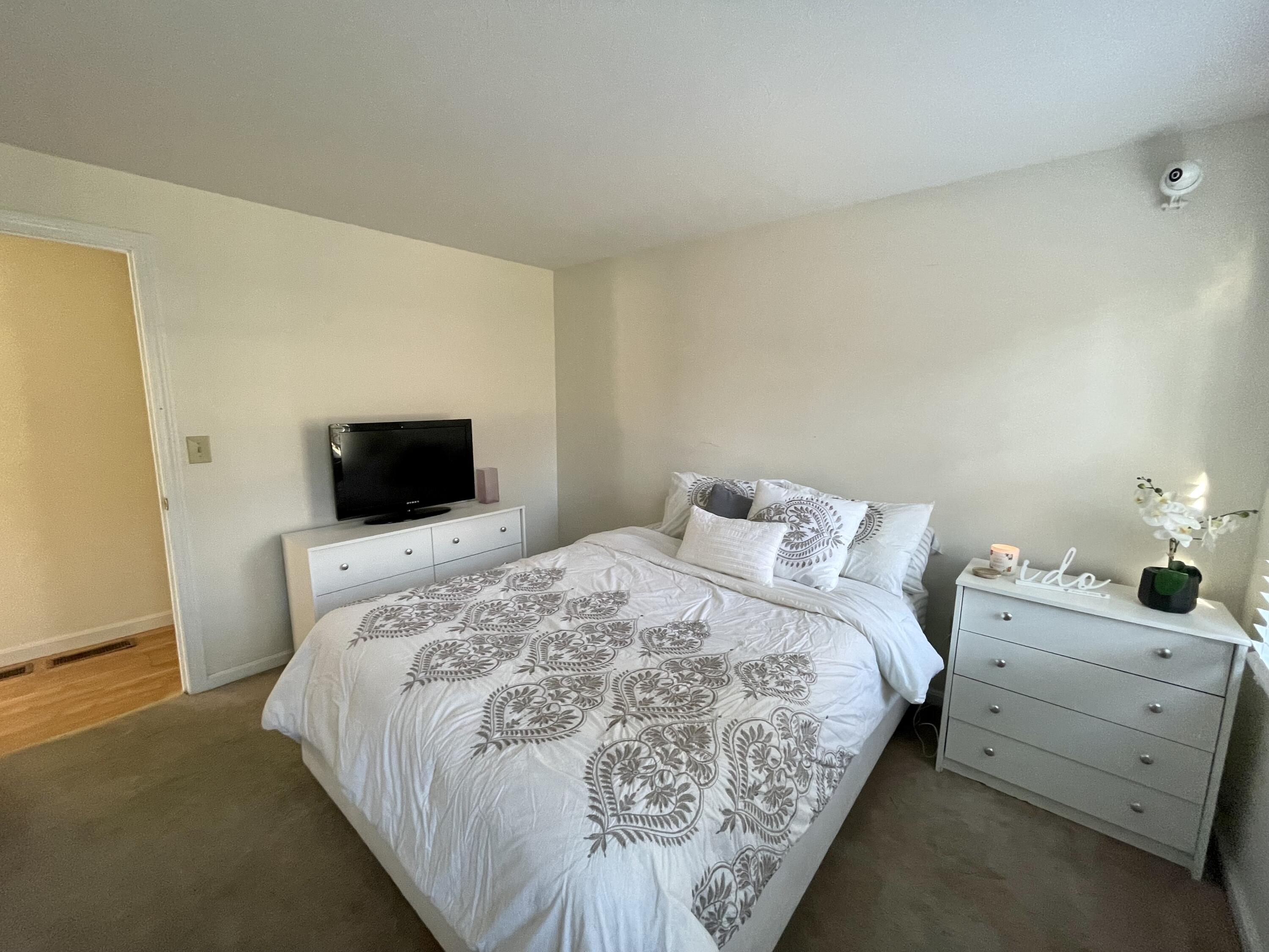 97 Braley Jenkins Road Centerville, MA 02632 - Photo 33 of 39 a bedroom with a bed and a television