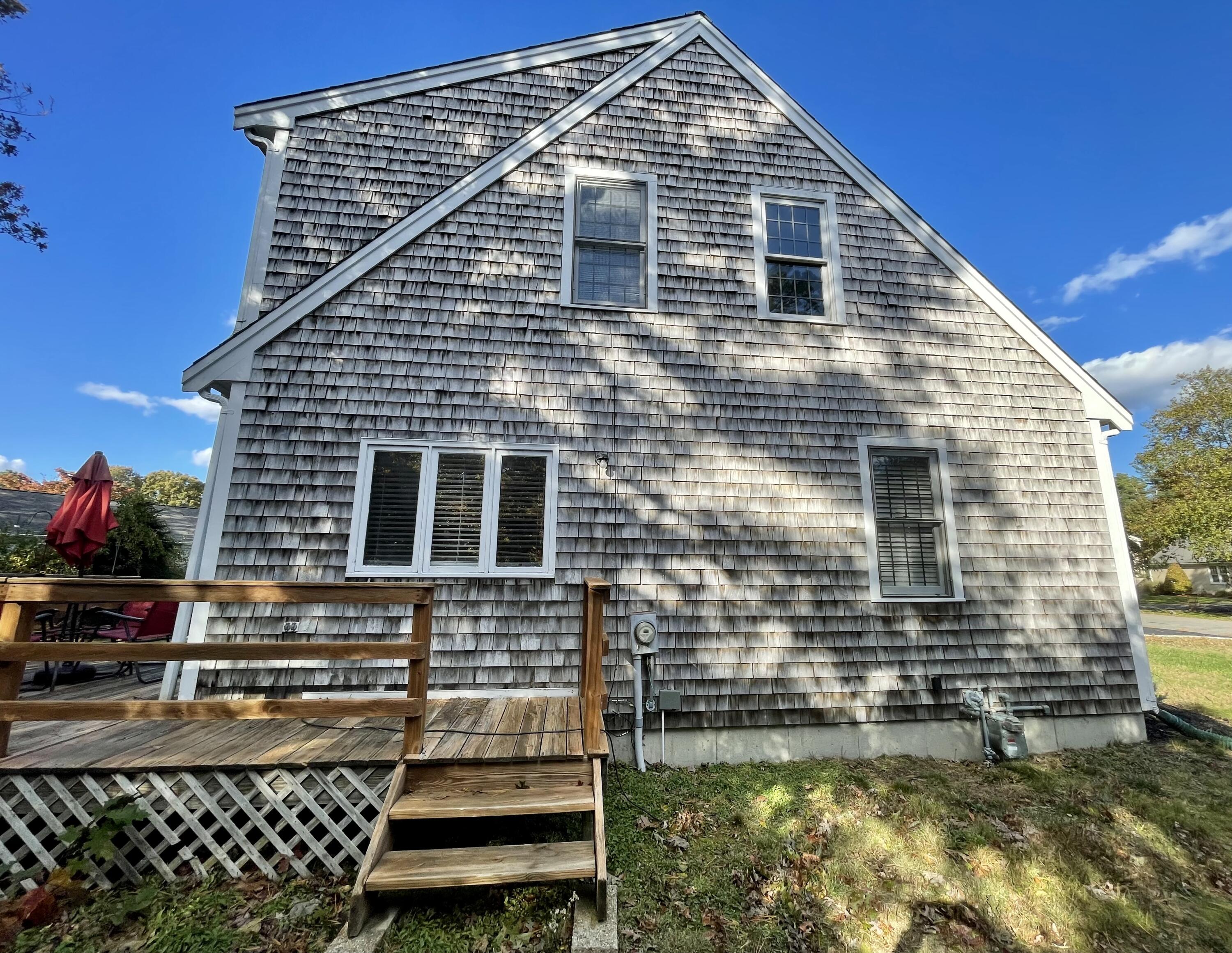 97 Braley Jenkins Road Centerville, MA 02632 - Photo 6 of 39 a front view of a house with a yard