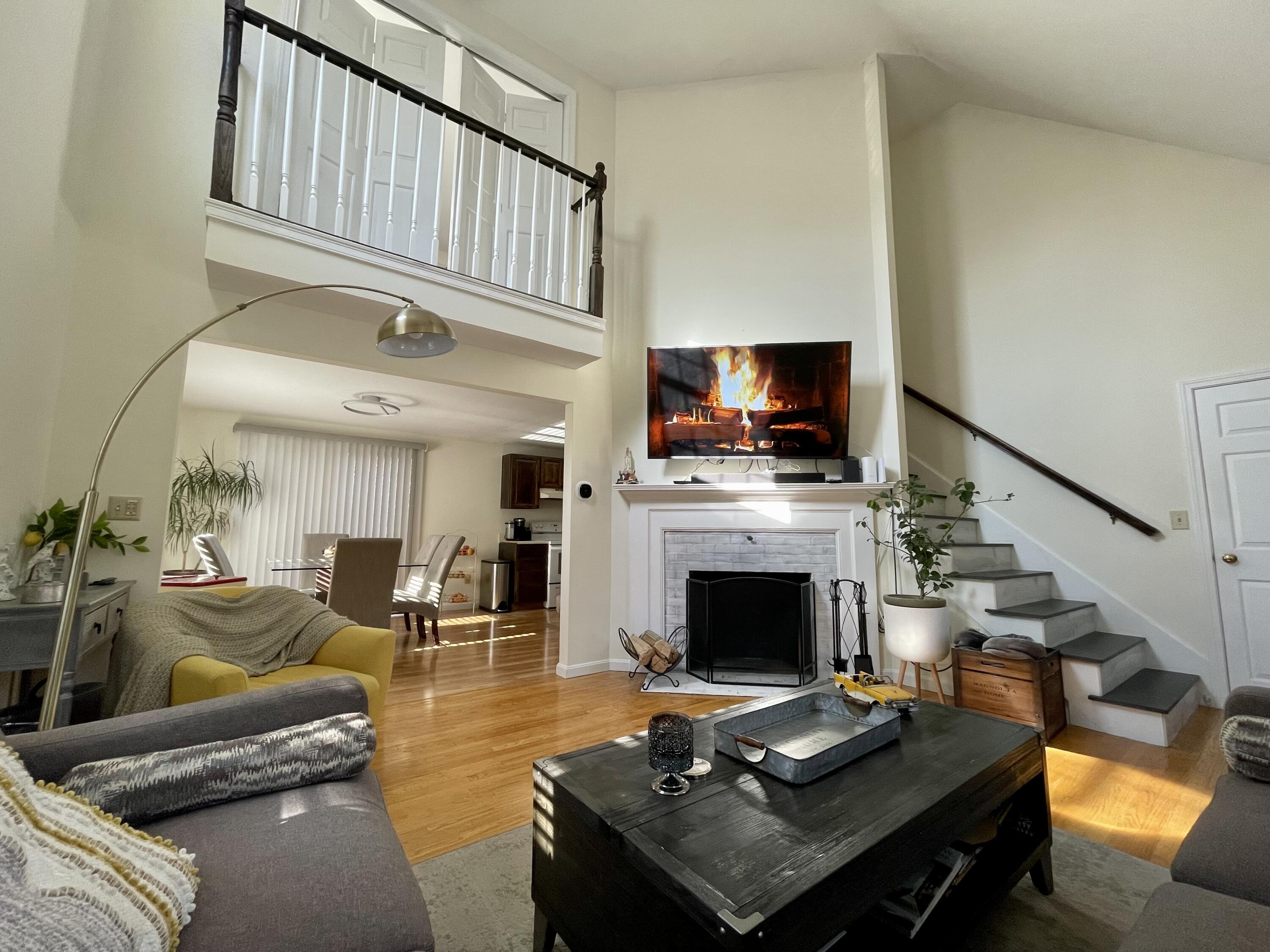 97 Braley Jenkins Road Centerville, MA 02632 - Photo 10 of 39 a living room with furniture fireplace and flat screen tv
