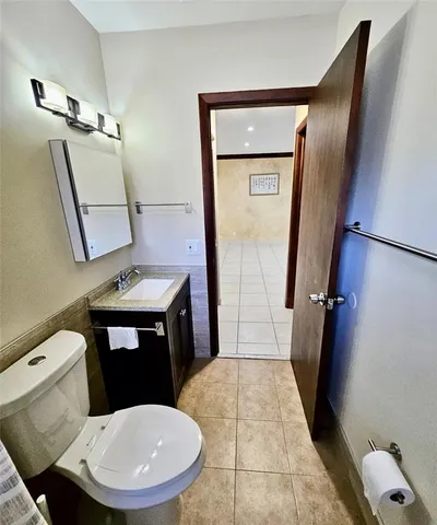 a bathroom with a sink a mirror and a bathtub