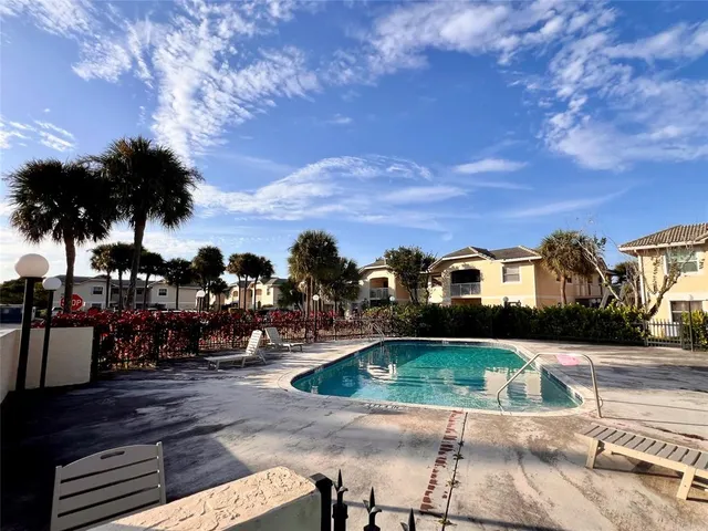 a view of house with a yard